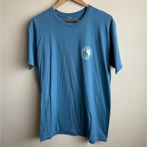 T&C surf designs shirt featuring fish design on back